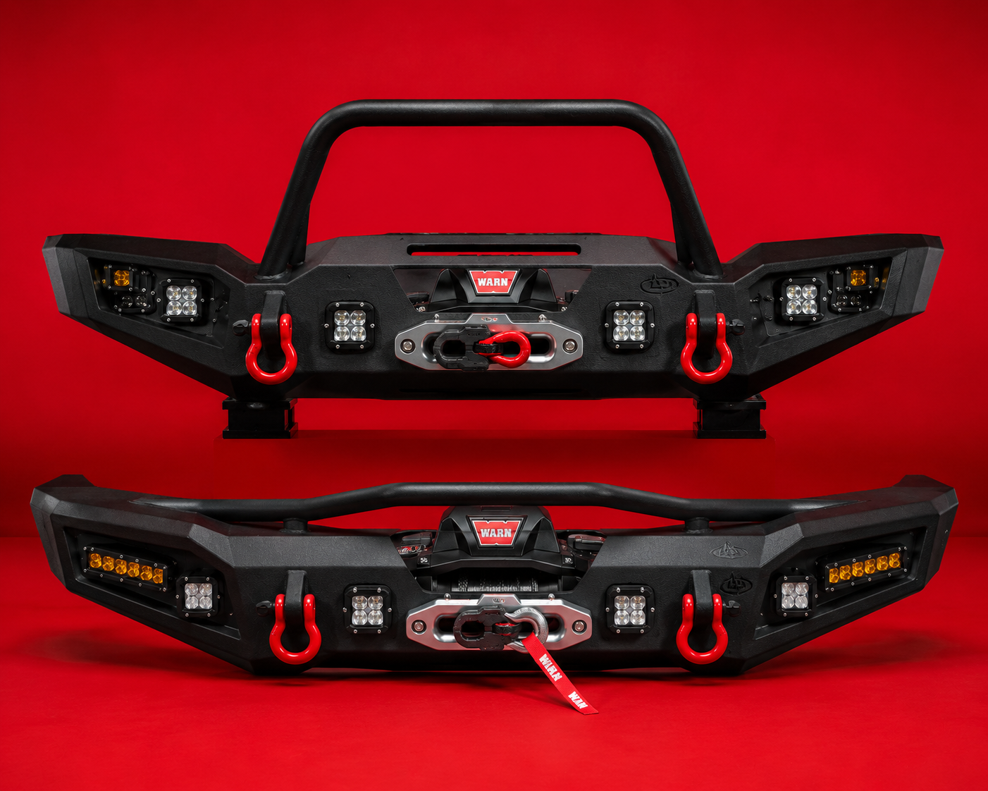 Two heavy-duty steel off-road front bumpers with WARN winches, red D-ring shackles, and LED pod lights on a bold red backdrop
