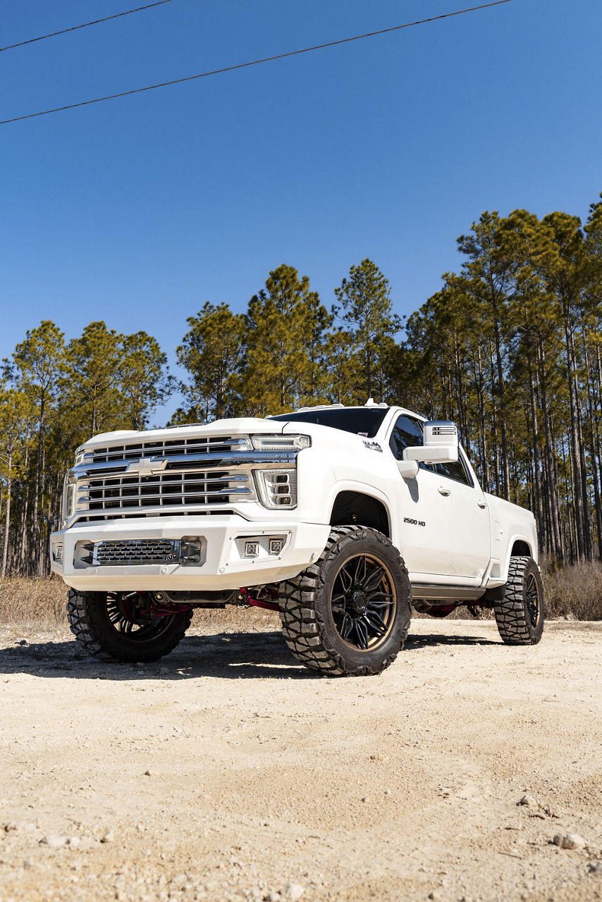 Off-road wheel and all-terrain tire package mounted on a lifted truck