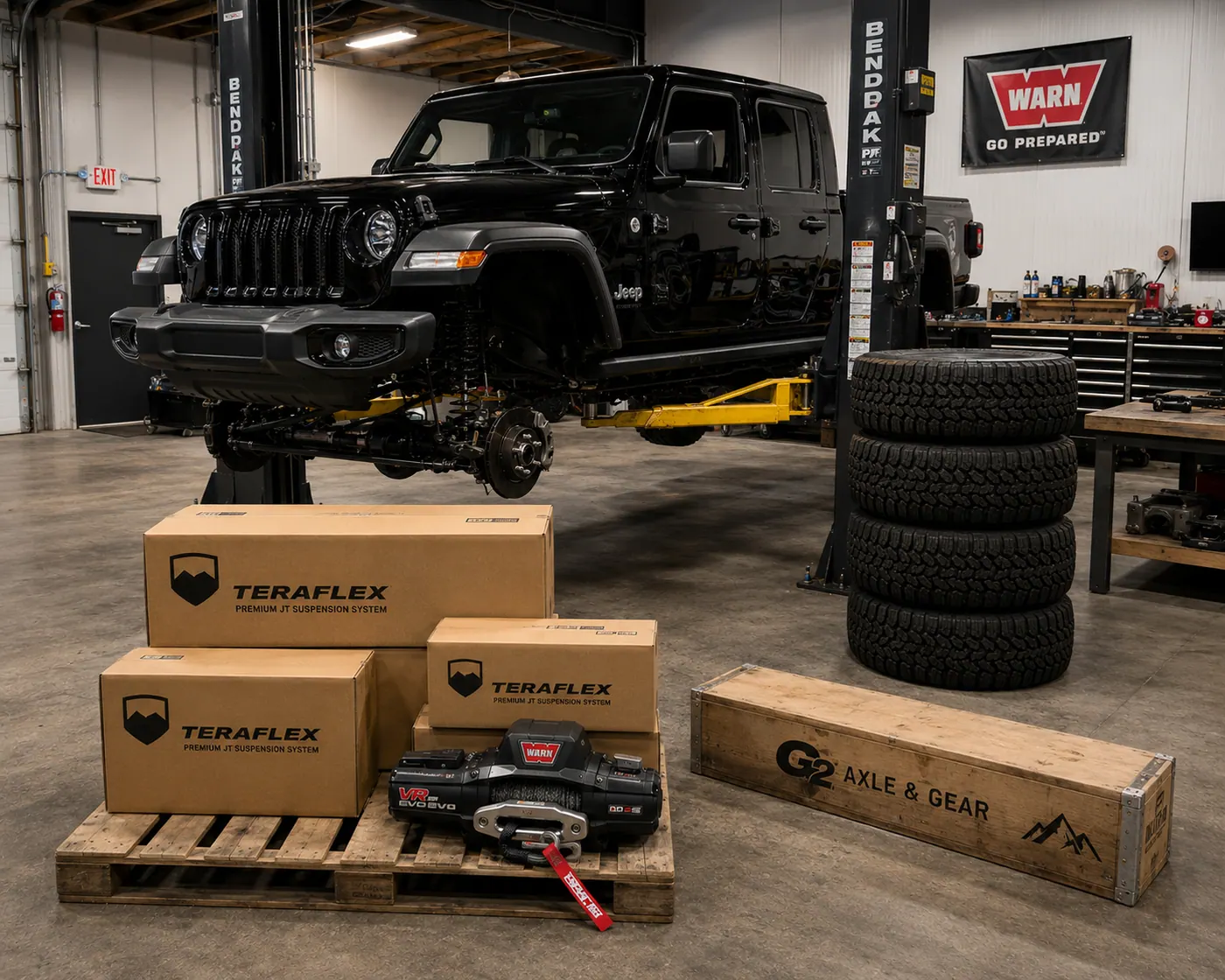 Teraflex, Warn, and G2 Axle & Gear parts crates in the SunCoast shop with a lifted Jeep Wrangler